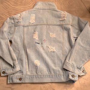 Distressed denim jacket